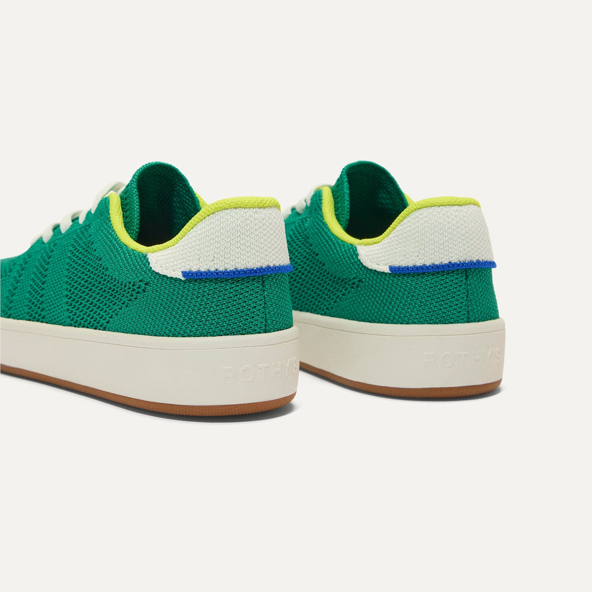 Close up of the heel of The Kids Stretch Sneaker in Emerald Pop, with Rothy's signature blue halo.