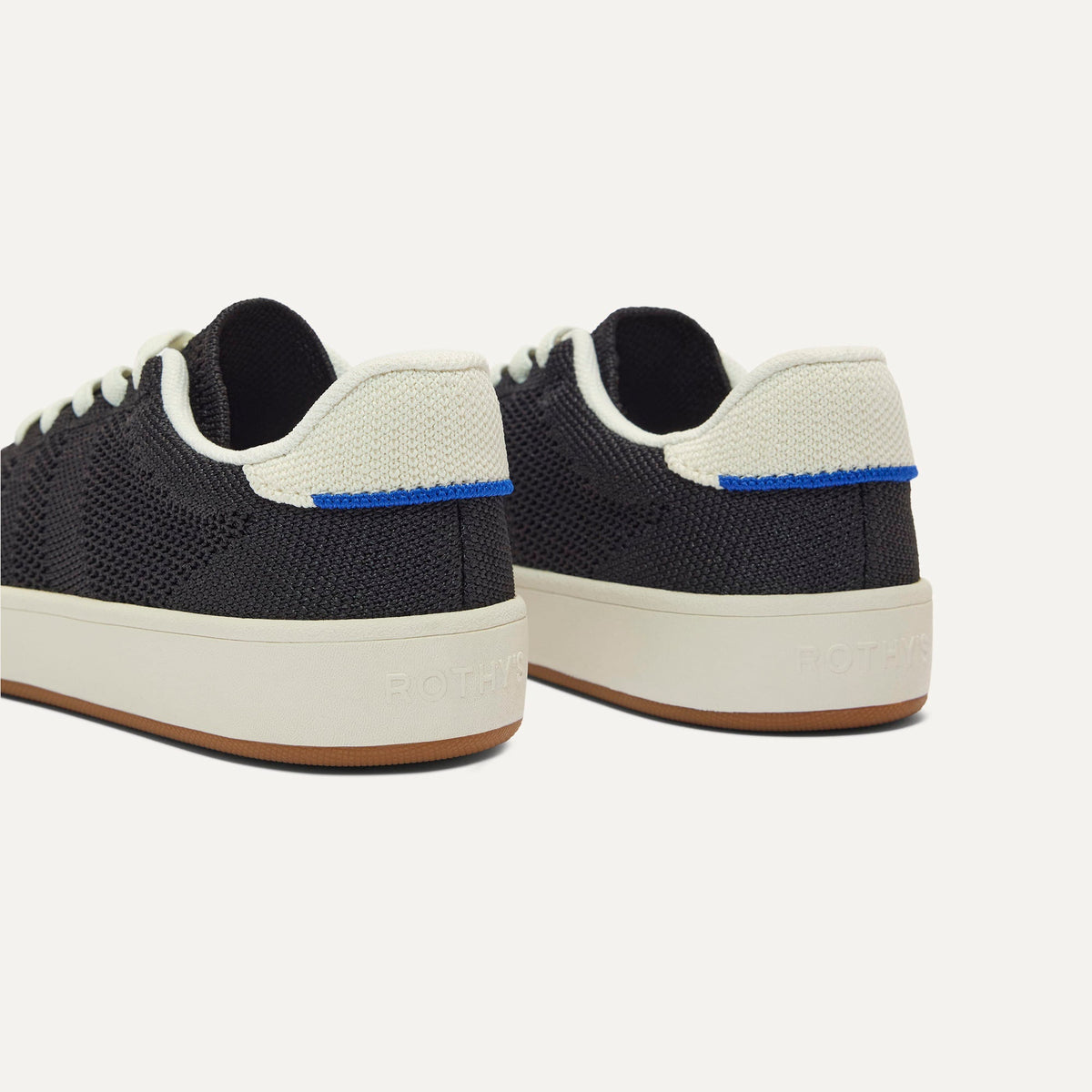 Close up of the heel of The Kids Stretch Sneaker in Zoom, with Rothy's signature blue halo.