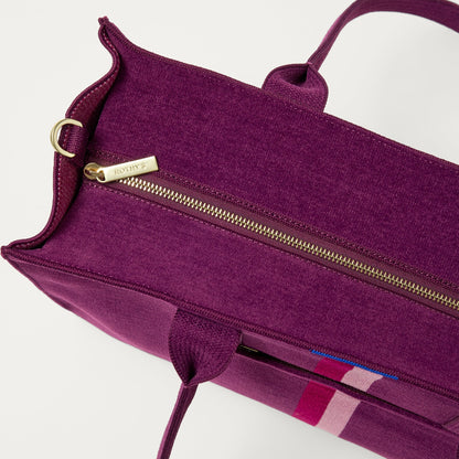The Classic Tote in ReVelvet Orchid, shown from above, with the top zipper closed.