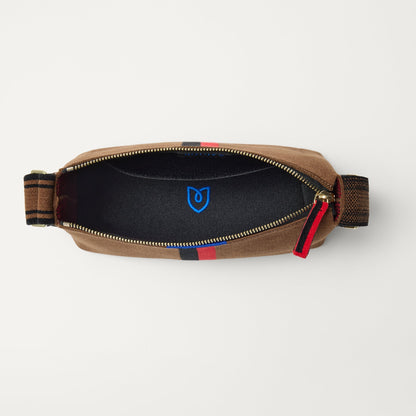 The Casual Crossbody in ReVelvet Cinnamon Stripe, shown from above, with the interior exposed.