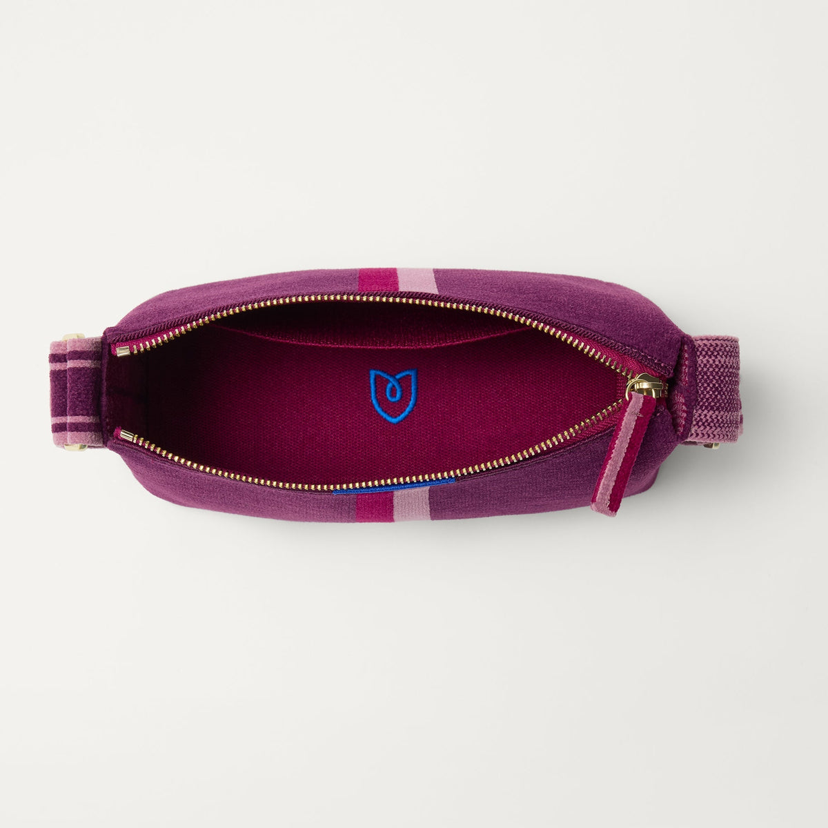 The Casual Crossbody in ReVelvet Orchid, shown from above, with the interior exposed.