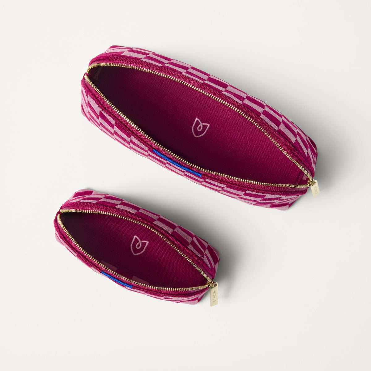 The Vanity Set in ReVelvet™ Orchid shown from the top with zipper closure open.