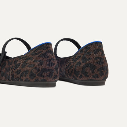 Close up of the heel of The Square Mary Jane in Classic Cheetah, with Rothy's signature blue halo.